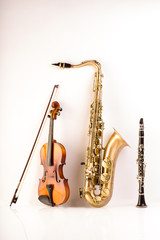 Sax tenor saxophone violin and clarinet in white