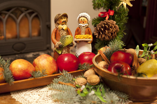 Xmas composition with figures, apples and needles