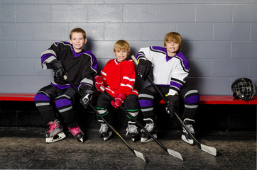 Obraz premium Youth Hockey Players in Dressing Room