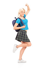 Excited young female student with a raised hand