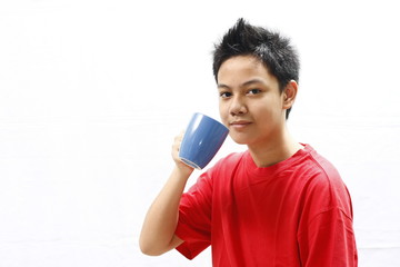 Boy Teenager Holding a Mug