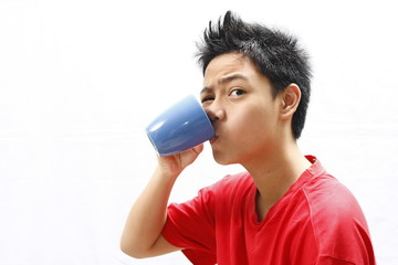 Boy Teenager Drinking From Mug