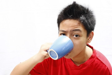 Boy Teenager Drinking From Mug