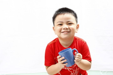 Little Boy Holding Mug