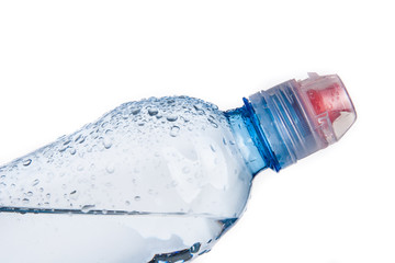 Plastic bottle of drinking water isolated on white