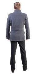 Back view of handsome business man in coat
