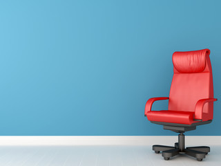 Red chair against blue wall