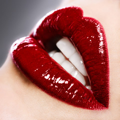 Beautiful female with red shiny lips close up - 49043148