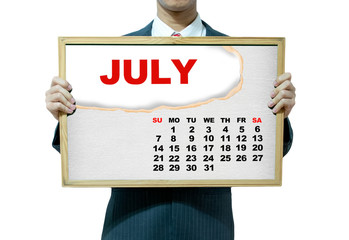 Business man holding board on the background, 2013 calendar