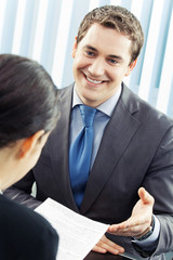 Businesspeople, or businessman and client