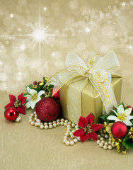 Wrapped present with festive Christmas decorations.