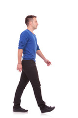 Fototapeta premium young casual man walking forward