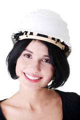 Portrait of confident female worker in helmet.