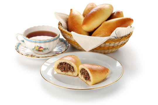 piroshki stuffed with ground beef, and a cup of tea