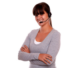 Smiling latin young woman using headphones