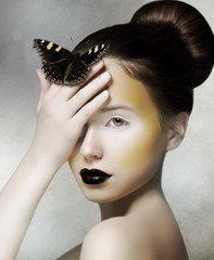 Romantic Woman holding Butterfly in her Hand. Fantasy © gromovataya