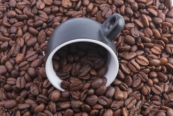 Coffee beans are poured into the inverted cup