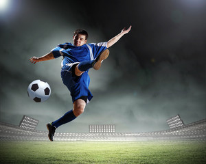 football player striking the ball