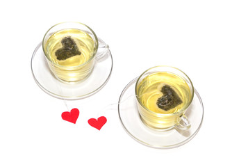 Two cups of tea with hearts