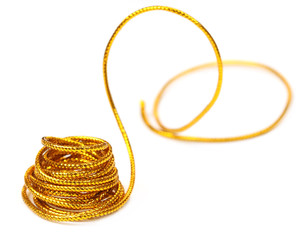 Golden rope over white background