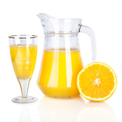Jug of orange juice and citrus fruits isolated on white
