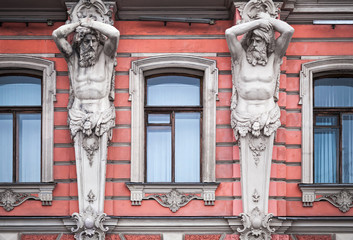 Obraz premium Facade with men statues. Old palace in St.Petersburg, Russia