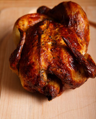 Whole Roast Chicken on a Wood Cutting Board