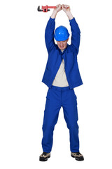 Workers raising wrench