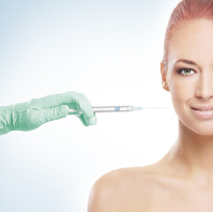 Portrait of a naked redhead woman on a botox procedure