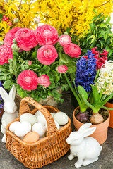 assorted spring flowers with home easter decoration