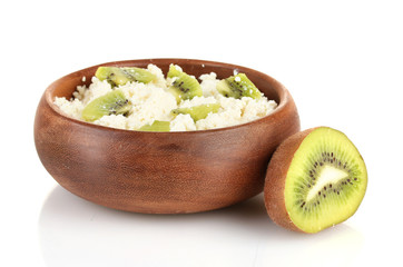 Cottage cheese in color bowl with kiwi fruit, isolated on white