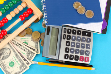 Bright wooden abacus and calculator. Conceptual photo of old