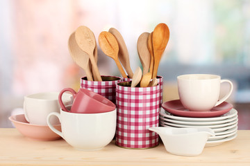 Cups, bowls nd other utensils in metal containers isolated