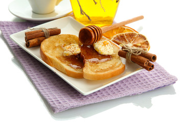 White bread toast with honey and cup of coffee, isolated