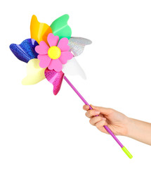 Colored pinwheel in hand isolated on white