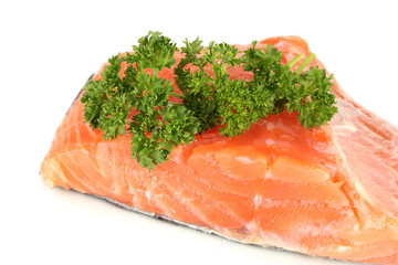 Fresh salmon fillet with parsley, isolated on white