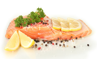 Fresh salmon fillet with herbals and lemon slices, isolated