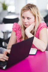 Two college students having fun studying together