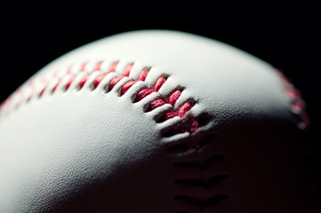 Close-up of a baseball ball, black background, studio shot