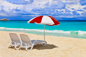 Chairs and umbrella at tropical beach