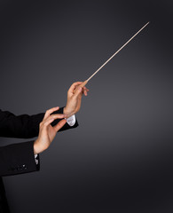 Music conductor with a baton