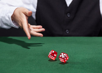 Croupier throwing a pair of dice