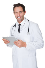 Portrait of friendly doctor with digital tablet