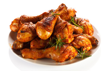 Grilled chicken legs on white background