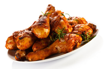 Grilled chicken legs on white background