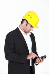 Man with helmet and cell phone