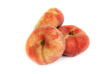 Three ripe fig peach on white