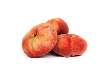 Three ripe fig peach on white