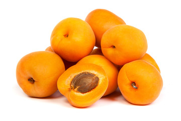 Group of ripe apricots with a half