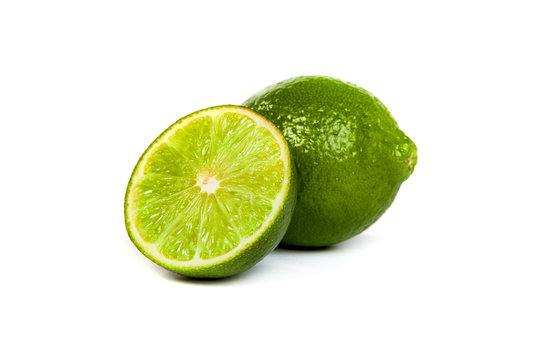 One whole lime and one half lime on white